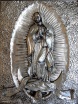Silver bas relief of Our Lady of Guadalupe at the basilica in San Juan, TX